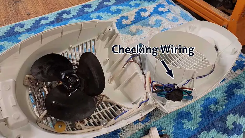 checking the wiring inside the fan