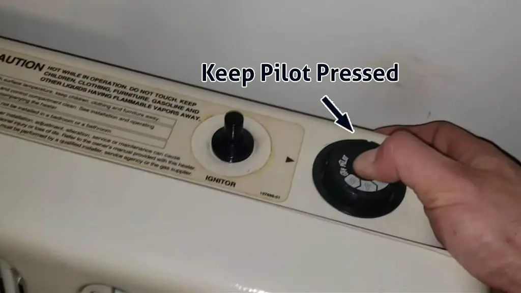 keep pilot pressed in glo warm heater